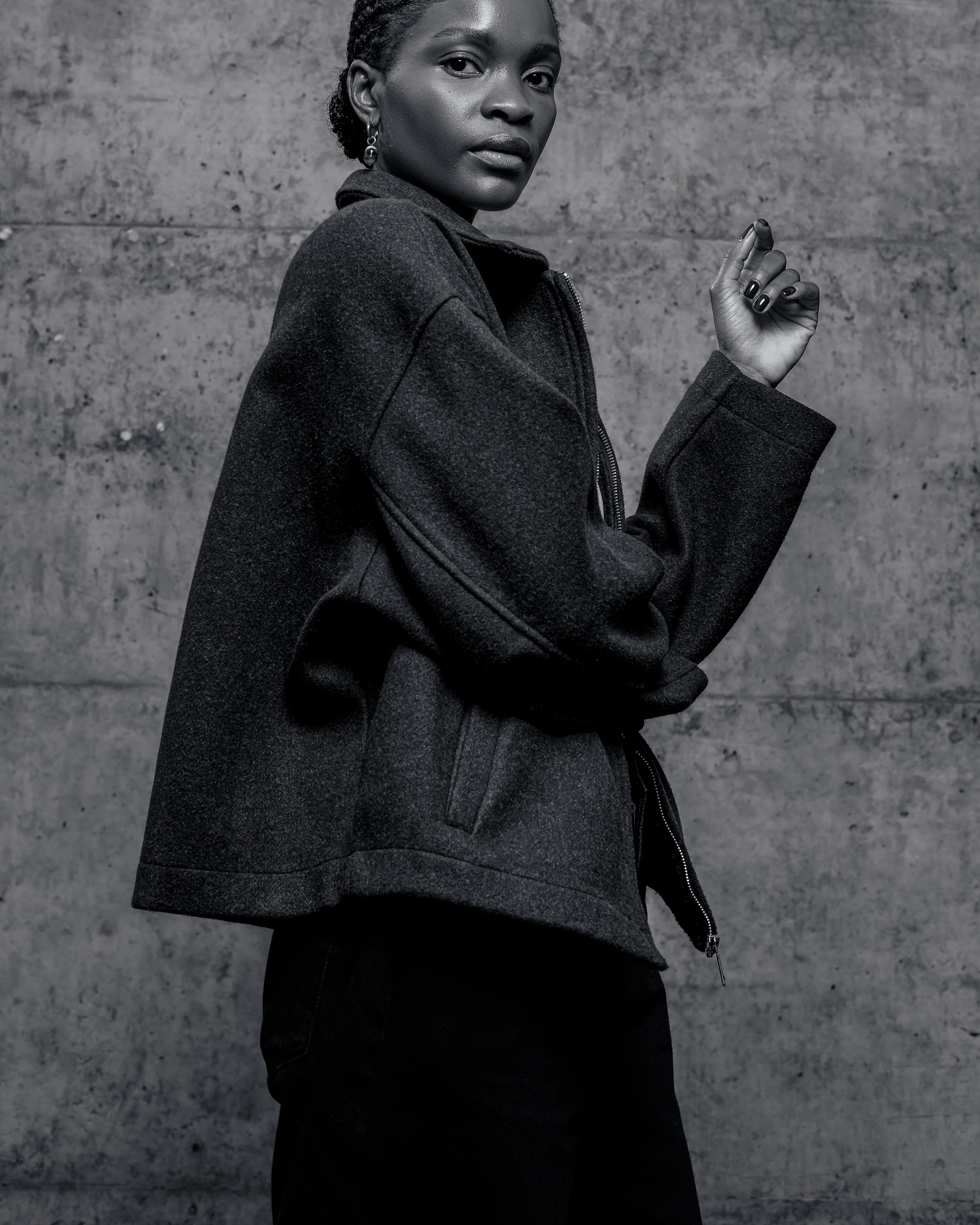  Tukiya's Closet coat against a textured wall.
