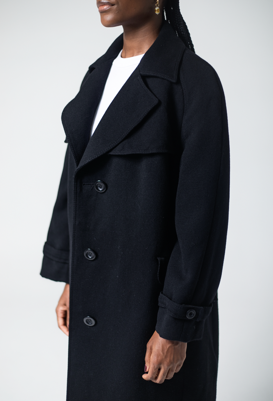 Women's black wool coat with tailored fit and lapel collar