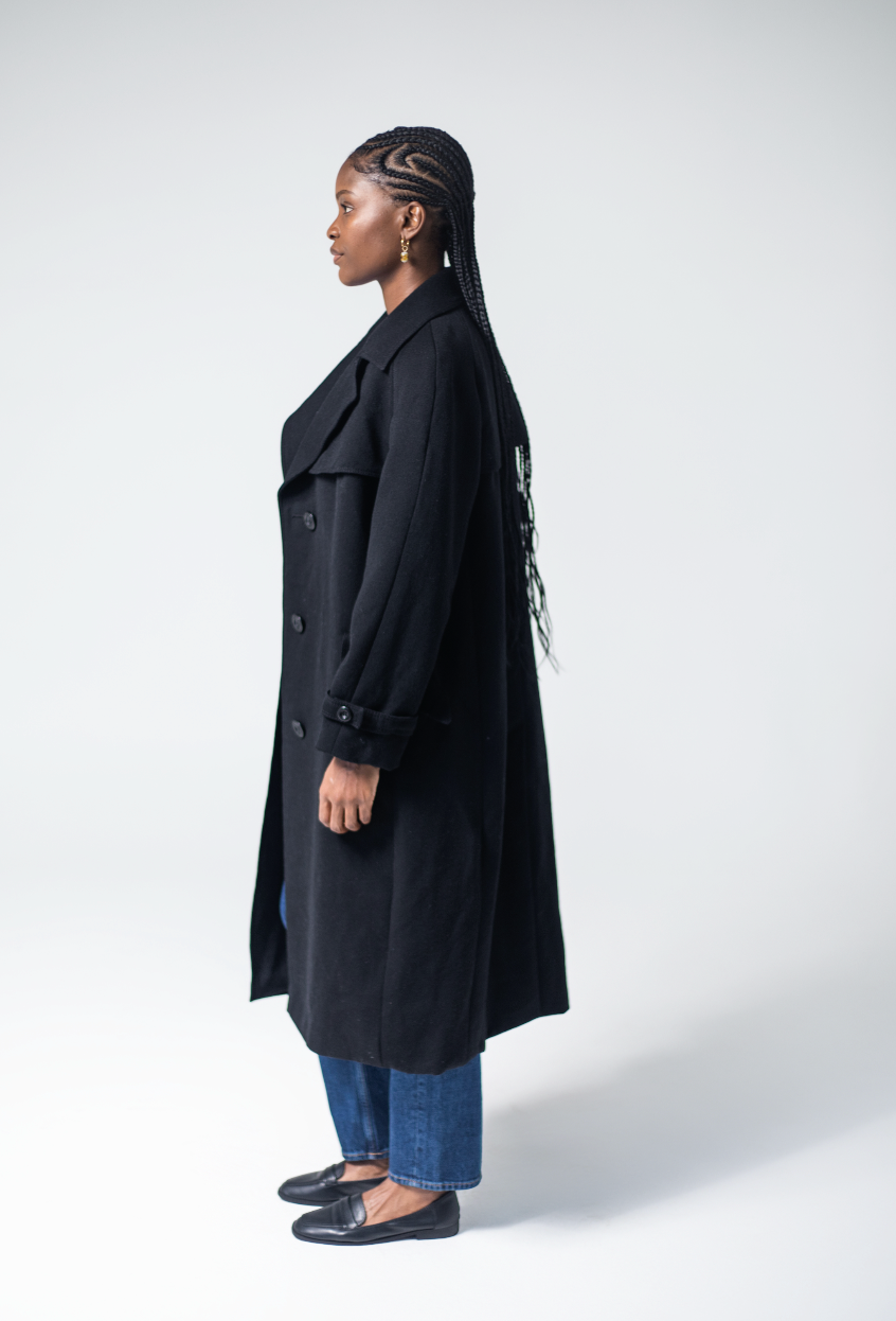 Women's black wool coat with tailored fit and lapel collar